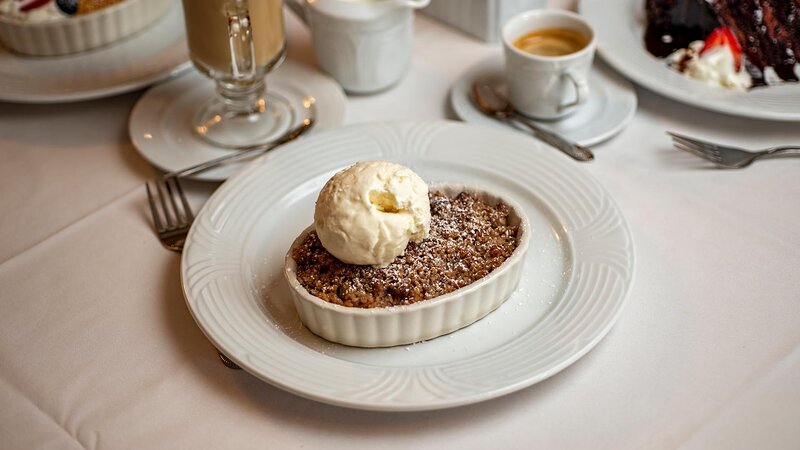 Apple crumble dessert topped with ice cream