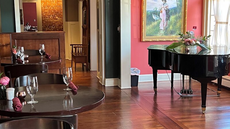 Piano room with high top tables