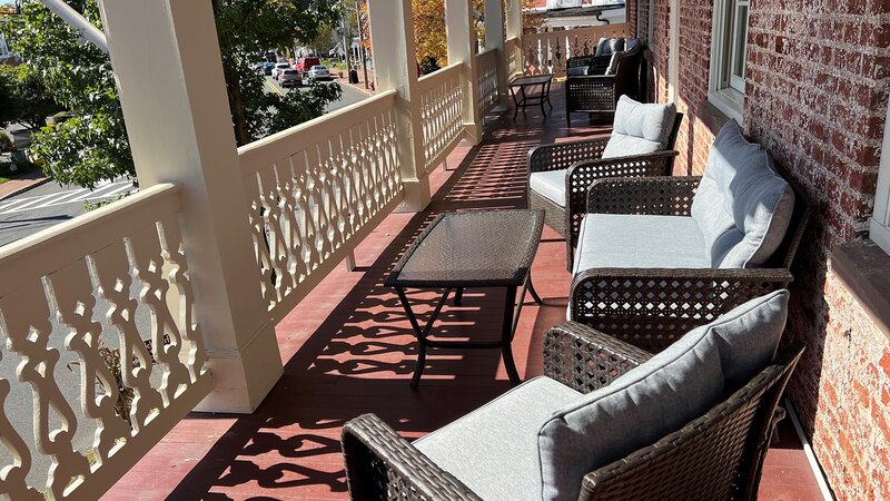 Upstairs patio seating with couches